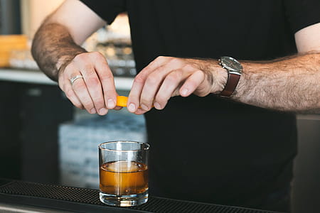 Bartender Adding Twist To Drink Photo thumbnail