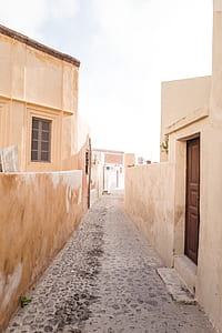 beige single-story house and walls thumbnail