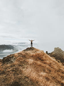 woman standing on cliff thumbnail