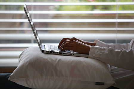person typing on laptop computer thumbnail