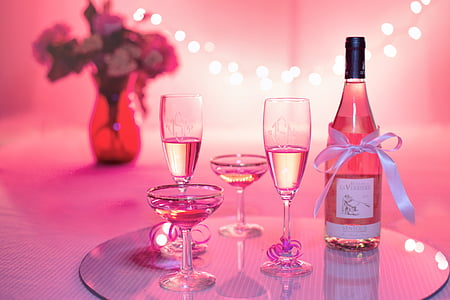 clear glass bottle and clear wine glasses thumbnail