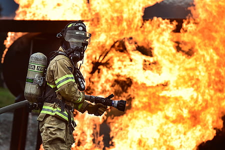 fireman catching fire wearing a mask thumbnail