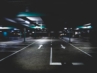 empty pathway under turned on lights during nighttime thumbnail