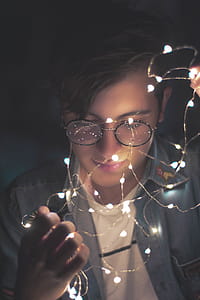Photography of Man Wearing Eyeglasses thumbnail