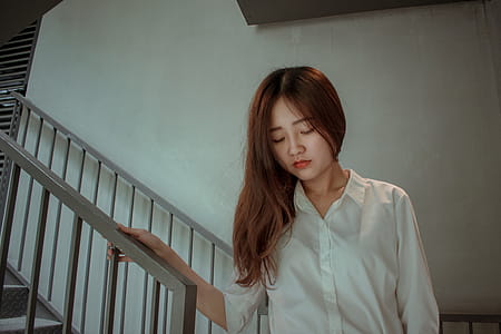 Photo of Woman Holding the Handrails thumbnail