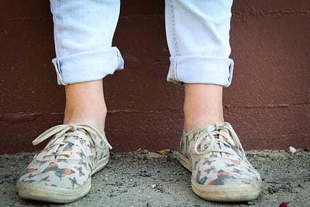Person Wearing Brown Low-top Sneakers thumbnail