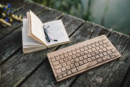 Male hand on the wooden keyboard thumbnail