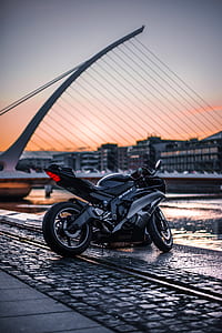 black and gray sportbike near boat thumbnail