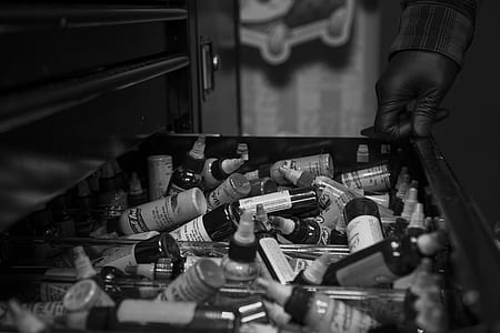 grayscale photography of medical vials on drawer thumbnail