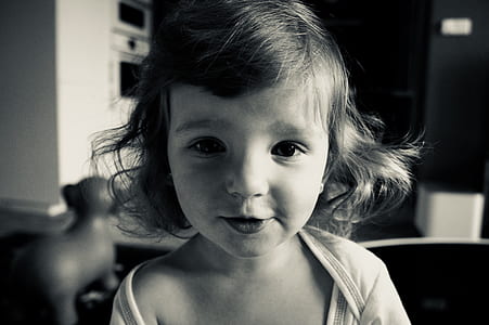 Gray Scale Photo of Girl Wearing Scoop Neck Shirt thumbnail
