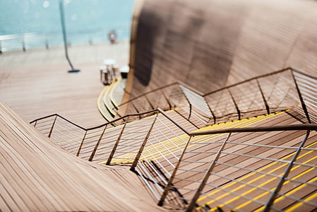 architectural photography of brown and yellow staircase thumbnail