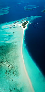 aerial photography of an island in body of water thumbnail