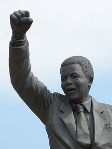 man raising his hand statue thumbnail