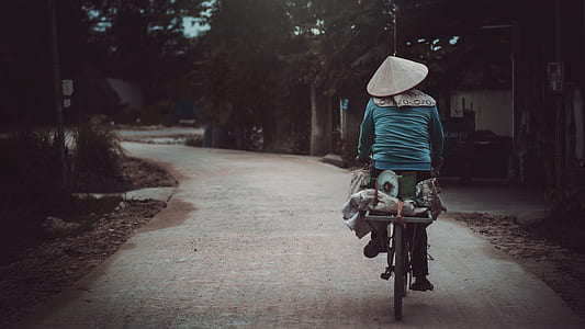 Person Riding a Bicycle Cycling on Road thumbnail