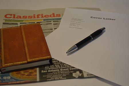 black retractable pen on white printing paper thumbnail