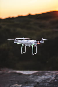 white and red quadcopter drone on mid air thumbnail