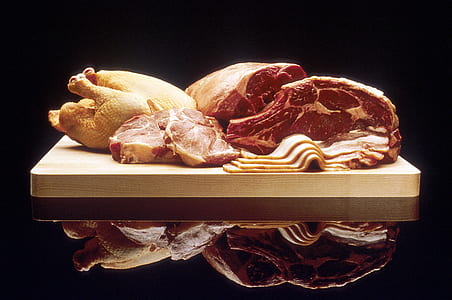 raw meat and chicken on brown chopping board thumbnail