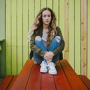 woman sitting on a picnic table thumbnail