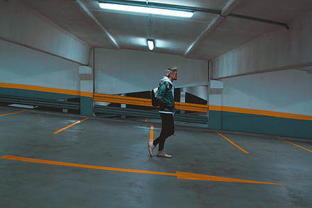 man in green hoodie and black pants thumbnail