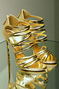 pair of women's gold ankle-strap heels thumbnail
