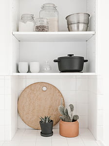 black casserole on white wooden shelf thumbnail