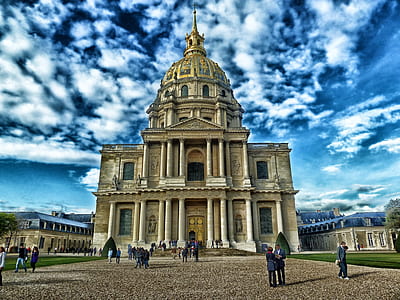 people near beige concrete building with dome under white clouds and blue sky during daytime thumbnail