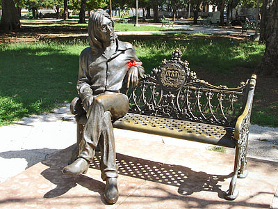 man in bench statue thumbnail