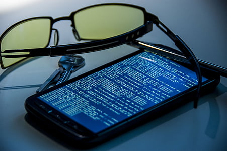 black Android phone near sunglasses thumbnail
