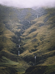 green mountain with waterfalls at daytime thumbnail
