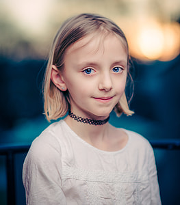 smiling girl wearing white scoop-neck top thumbnail