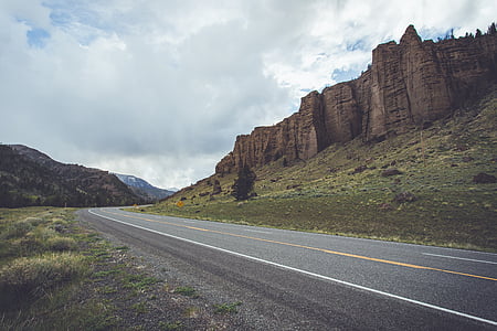 cliff near road during daytime thumbnail