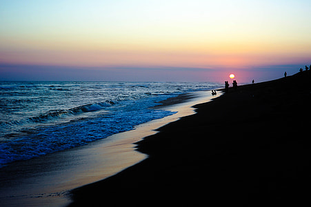 silhouette of people on beach thumbnail