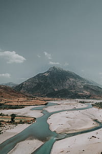 body of water under sunny sky thumbnail
