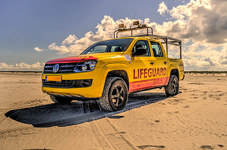 blue Volkswagen crew cab pickup truck on desert thumbnail