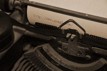 person showing black typing writer with white paper thumbnail