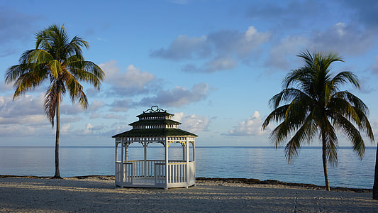 white gazebo by the beach thumbnail