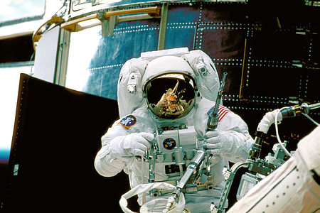 astronaut holding equipment thumbnail