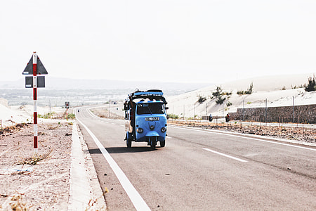 blue trike on road way during daytime thumbnail