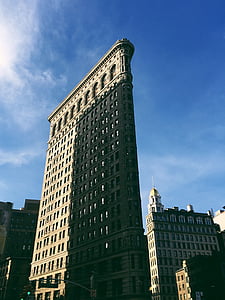 gray concrete building under blue sky during daytime thumbnail
