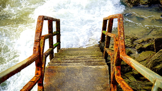 high-angle view of concrete ladder over body of water thumbnail