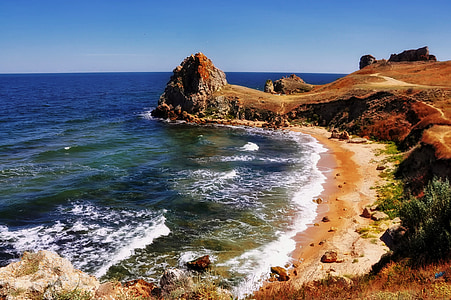 body of water near cliff thumbnail