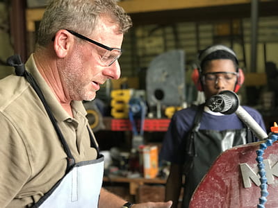 man wearing white apron thumbnail