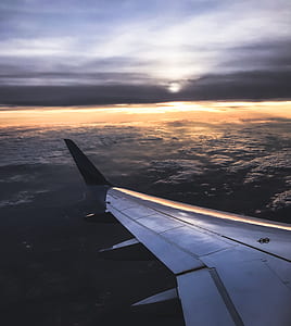 aerial photo of left plane wing during sunset thumbnail