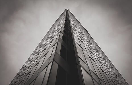 grayscale photography of curtain glass building thumbnail
