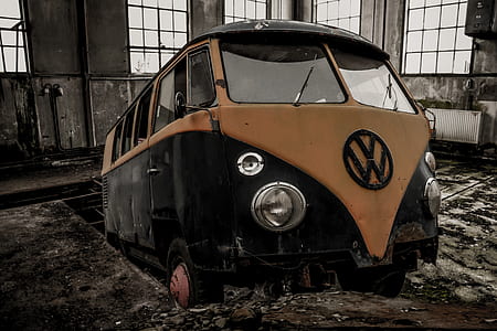 classic black and orange Volkswagen T2 van inside the building thumbnail