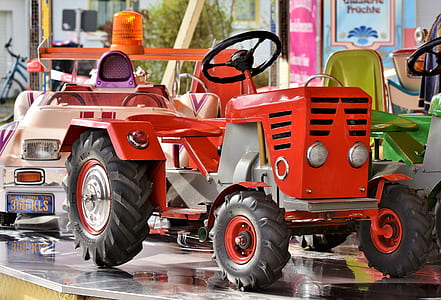 red ride-on tractor on table thumbnail