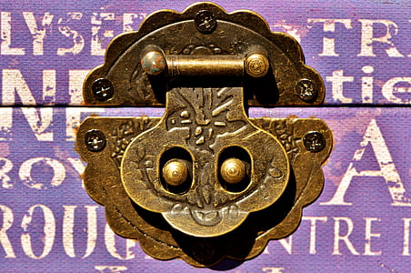 close-up photography of brass-colored luggage lock thumbnail
