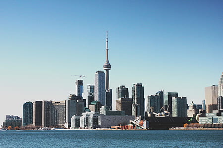 city buildings near body of water thumbnail