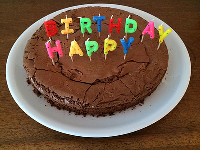 round chocolate cake on white ceramic plate thumbnail