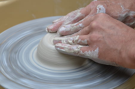 person molding clay thumbnail